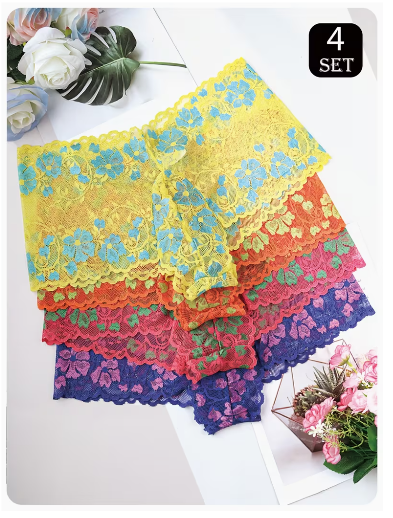Four pairs of mens lace briefs in a stacked fan arrangement, featuring yellow with blue, orange with green, pink with purple, and dark blue floral lace. The image is styled with decorative flowers and leaves on a white surface, with a '4 SET' label in the top right corner.